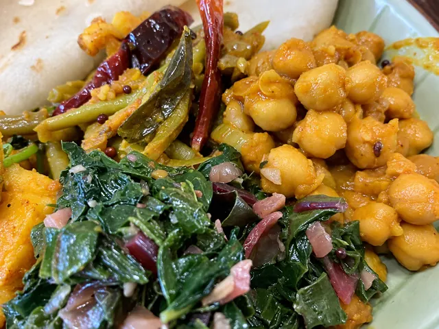 Beet leaf curry served with chickpeas