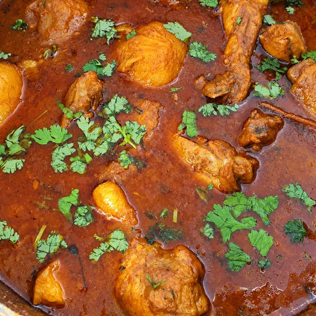 Durban chicken curry with potatoes in a pot