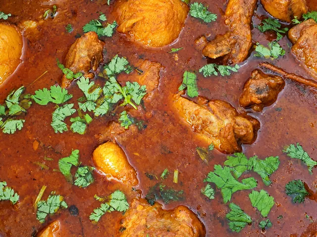 Durban chicken curry with potatoes in a pot
