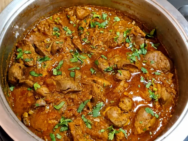 Durban chicken liver curry garnished with fresh herbs