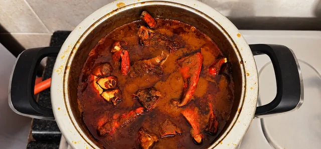 Durban crab curry cooking in a pot