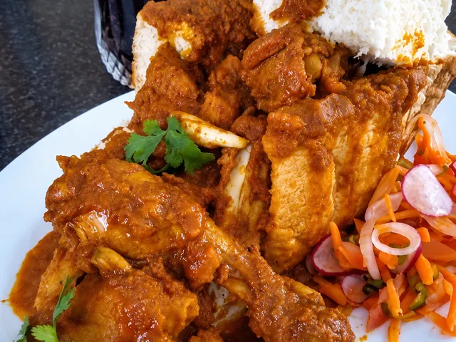 Irene’s chicken bunny chow with carrot salad