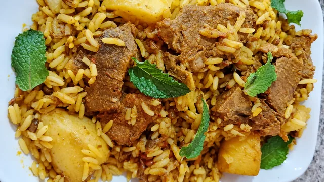 Lamb masala breyani with rice and fresh herbs