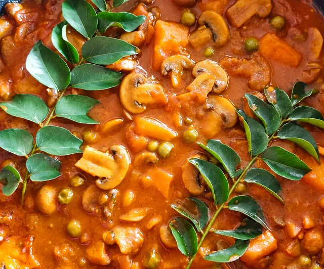 Mushroom, pea and potato curry with curry leaves