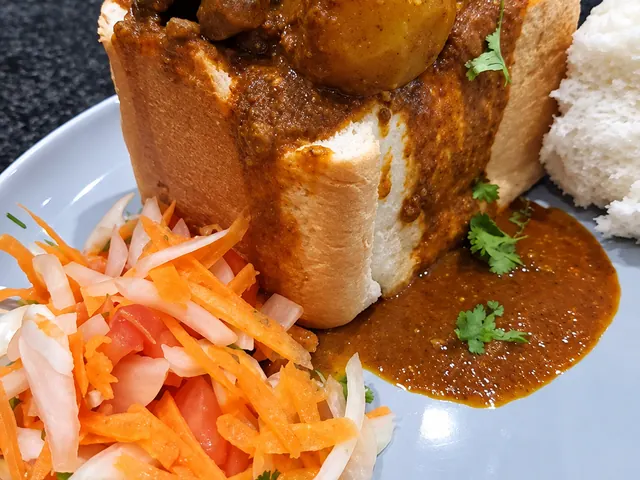 Mutton bunny chow served with carrot salad