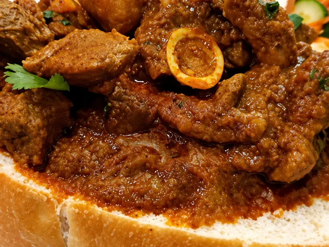 Mutton curry served in sourdough bread