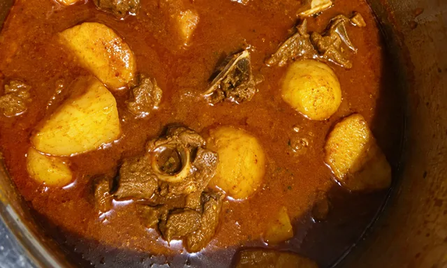 Mutton curry with potatoes in gravy