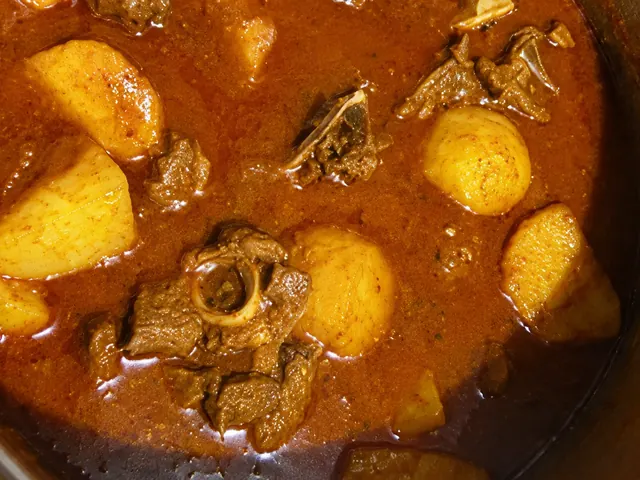 Mutton curry with potatoes in gravy