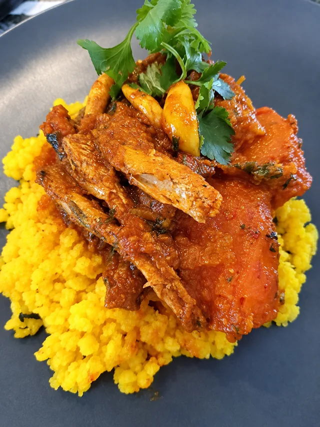 Tinned fish curry served with yellow mielie rice