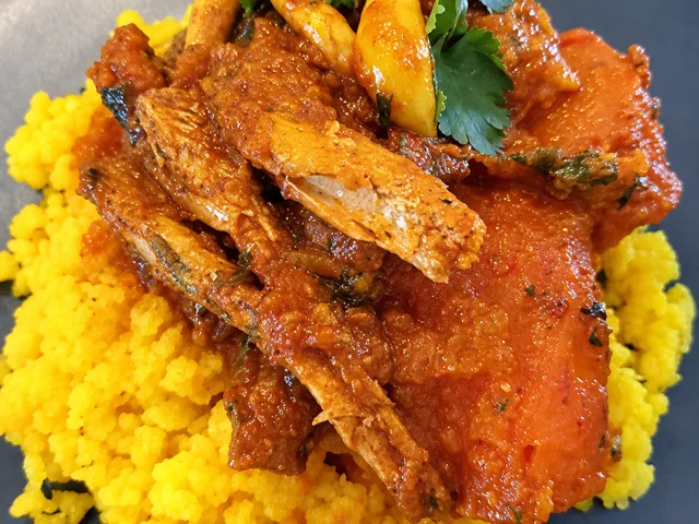 Tinned fish curry served with yellow mielie rice