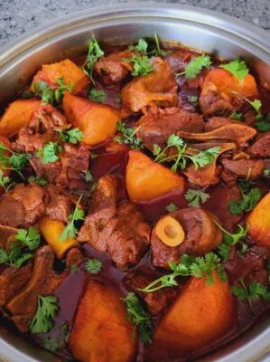 Aunty Maurine’s mutton curry with potatoes in a pot