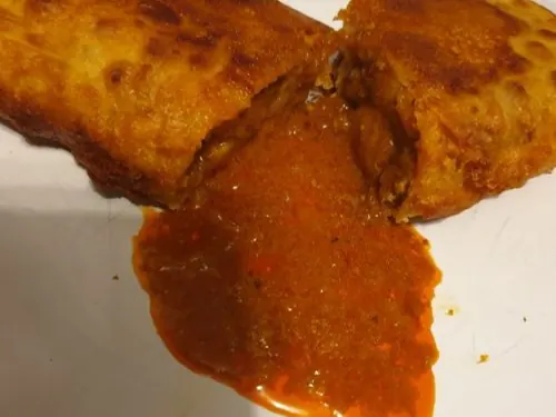 Battered and deep-fried mutton curry roti