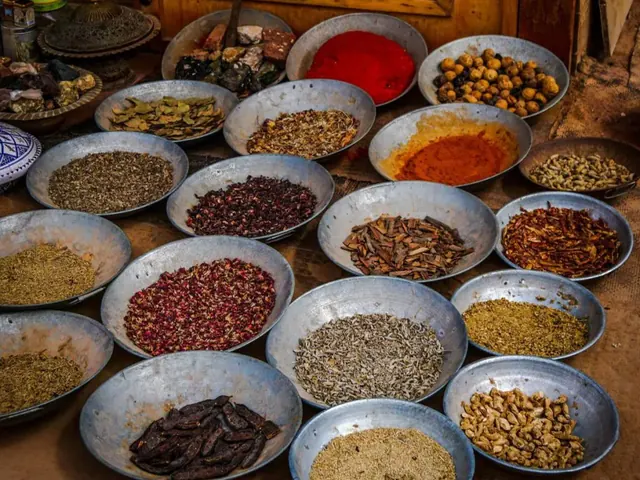 Bowls of whole and ground spices at a spice stall
