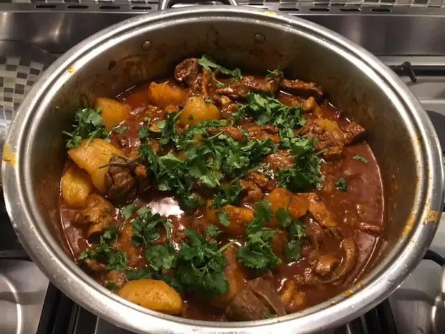 Byron’s mutton curry with potatoes and fresh herbs