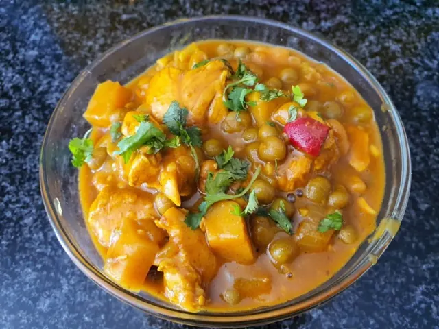 Chicken and vegetable curry in a glass bowl