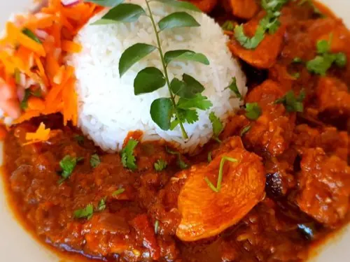 Chicken breast curry with rice and carrot salad