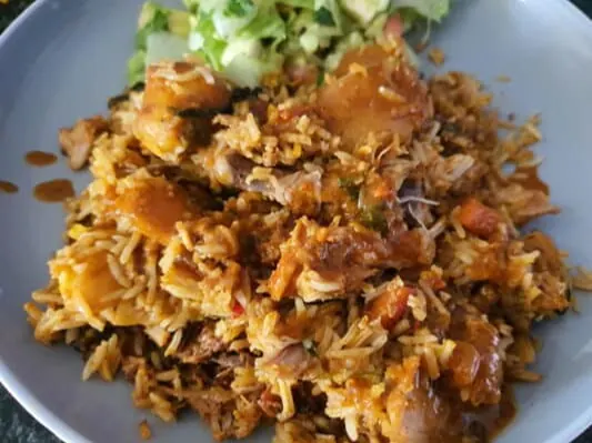 Chicken breyani topped with gravy