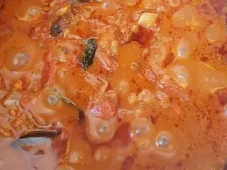 Curry sauce simmering in a pot