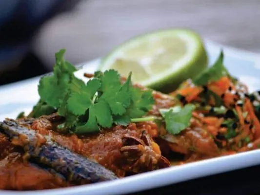 Dean Dickinson’s pickled fish garnished with herbs and lime