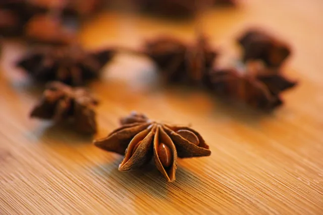 Dried star anise on a wooden board.