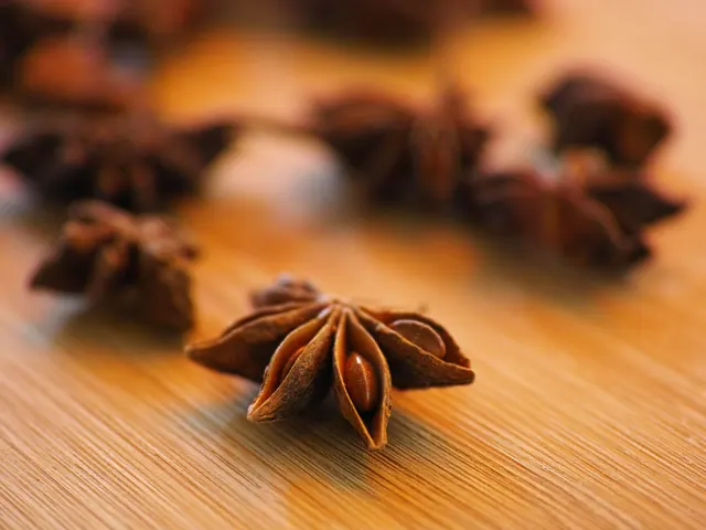 Dried star anise on a wooden board.