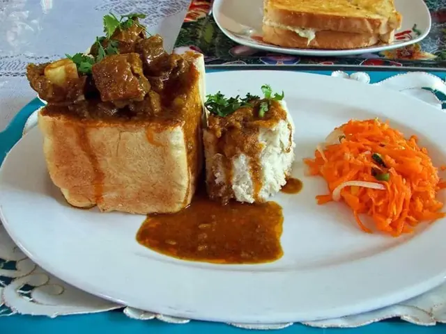 Durban bunny chow with carrot salad and gravy