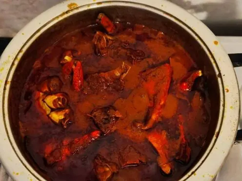 Durban crab curry cooking in a pot