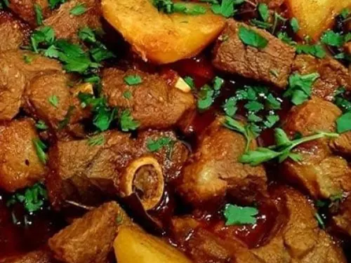 Durban mutton curry with potatoes and fresh herbs