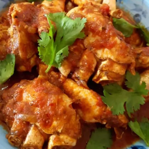 Jennifer’s crab curry garnished with fresh herbs