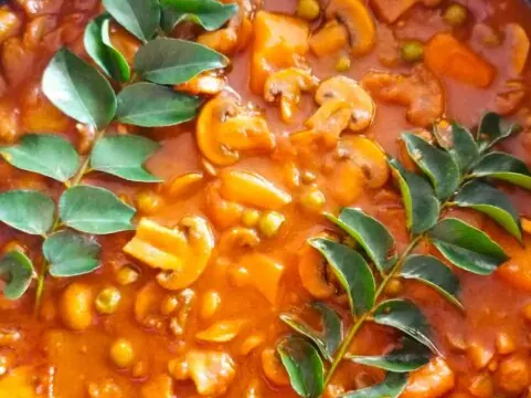 Mushroom, pea and potato curry with curry leaves