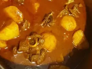 Mutton curry with potatoes in gravy