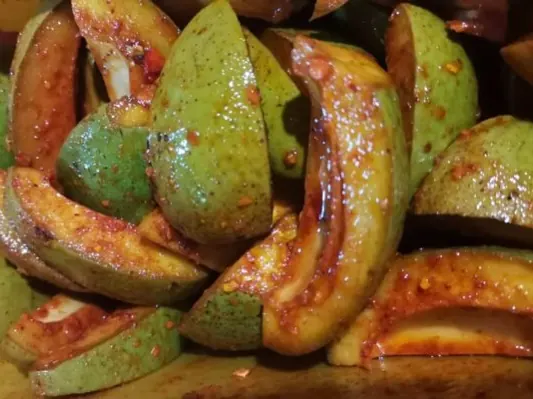 Spiced green mango pieces for Desa’s mango pickle
