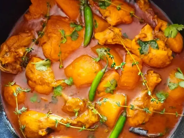 Spicy Durban chicken curry with potatoes and chillies