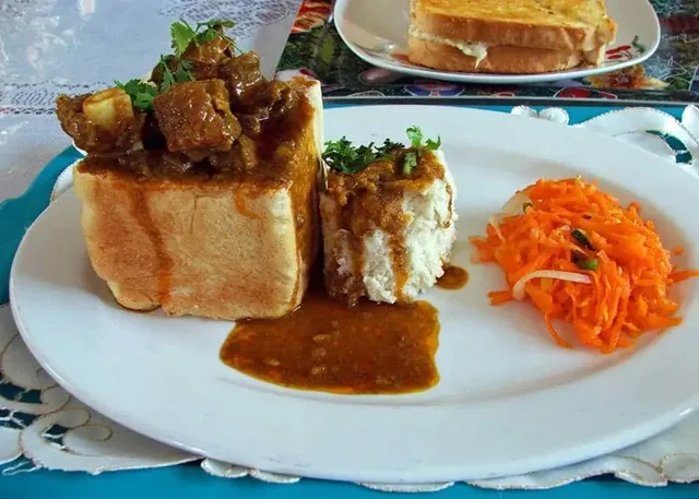 A typical Durban Bunny Chow and Sambals. Ready to be eaten with your fingers.