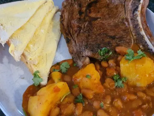 Sugar bean curry served with flame-grilled steak