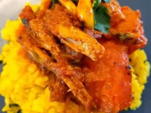 Tinned fish curry served with yellow mielie rice